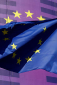 European Union flags flutter outside the European Commission headquarters in Brussels