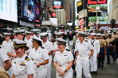 U.S. Navy sailors walk in Times Square during Fleet Week 2025 in New York City,