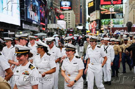 U.S. Navy sailors walk in Times Square during Fleet Week 2025 in New York City,