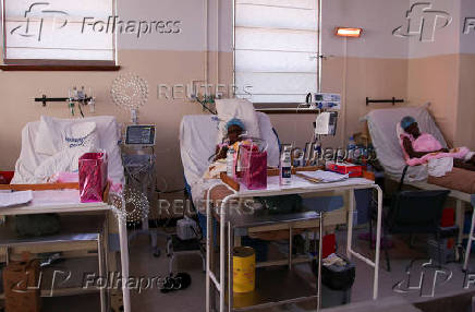 Women lie on beds at a maternity ward at Parirenyatwa Group of Hospitals, a major referral hospital in Harare
