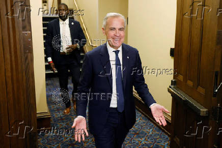 Canada's Prime Minister Mark Carney walks to the House of Commons for Question Period on Parliament Hill in Ottawa