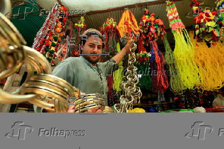 Roadside shop sells ornaments ahead of Eid al-Adha in Peshawar