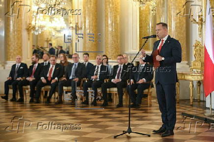 Polish President-elect Karol Nawrocki receives the winning certificate
