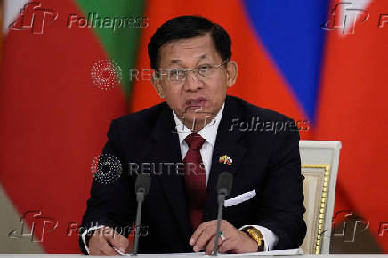 FILE PHOTO: Russia's President Vladimir Putin and Myanmar's military chief Min Aung Hlaing meet in Moscow