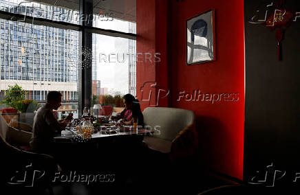 People eat at a Chinese restaurant in Moscow