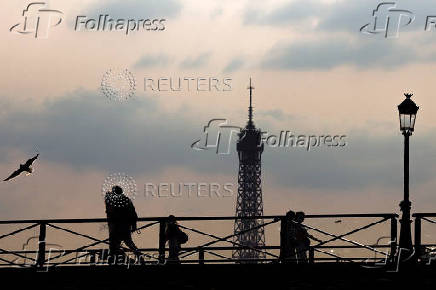 The Pont des Arts bridge and the Eiffel Tower in Paris