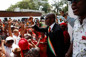 Partisans of PDCI (Democratic Party of Cote d'Ivoire) protest at their headquarters in Abidjan
