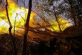 Ukrainian servicemen fire a self-propelled howitzer towards Russian troops at a frontline near the town of Chasiv Yar