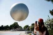 The return of a new Paris 2024 flame cauldron set on a balloon to the Tuileries Garden and the Paris skyline