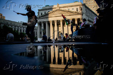People protest against federal immigration sweeps, near the U.S. immigration court at the Jacob K. Javits Federal Building, in New York