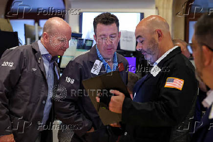 Traders work on the floor of the NYSE in New York
