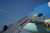 U.S. President Donald Trump boards Air Force One as he departs for Iowa, at Joint Base Andrews