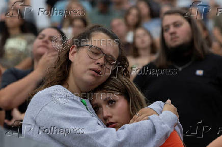 People attend a prayer service for flood victims in Kerrville