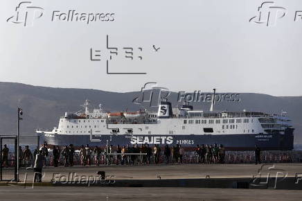Rescued migrants are transferred from Crete to the port city of Lavrio