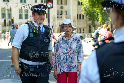 People gather in Parliament Square calling for the de-proscription of the Palestine Action group, in London