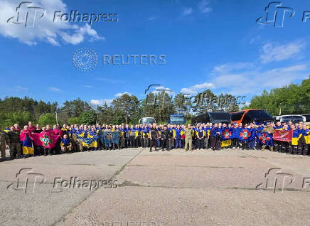 Ukrainian POWs are seen after a swap at an unknown location in Ukraine