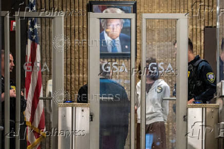 U.S. Congressman Jerry Nadler speaks to members of the Department of Homeland Security as one of his employees is detained at US Immigration Court in New York City