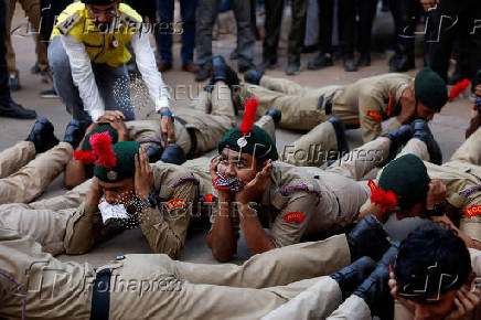 Cadets of National Cadet Corps (NCC) participate in a civil defence mock drill on street in Ahmedabad