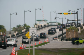 The motorcade of U.S. President Donald Trump arrives at his golf course in Jupiter, Florida