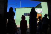People gather outside the Fellowship Baptist Church, where U.S. pastor Josh Sullivan was kidnapped, in Gqeberha