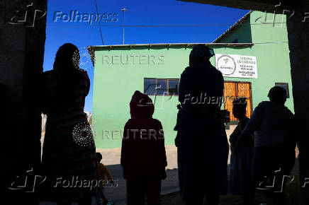 People gather outside the Fellowship Baptist Church, where U.S. pastor Josh Sullivan was kidnapped, in Gqeberha
