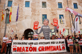 Protesters rally outside the gates of the Valencia regional parliament to demand the resignation of regional leader Carlos Mazon