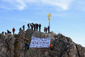 People display a banner reading: 