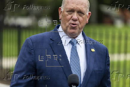 White House border czar Tom Homan talks with news media outside the White House