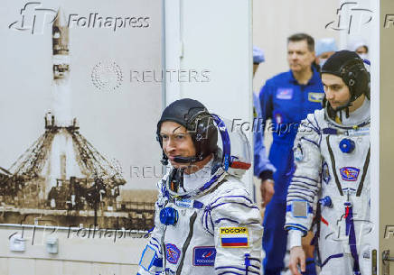 Roscosmos cosmonauts Sergey Ryzhikov and Alexey Zubritskiy arrive to the spacesuit check before the launch at the Baikonur Cosmodrome