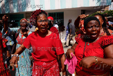 Partisans of PDCI (Democratic Party of Cote d'Ivoire) protest at their headquarters in Abidjan