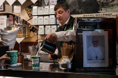 People watch the Pope's funeral in London