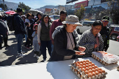 Long lines for basic goods amid shortages and rising prices, in La Paz