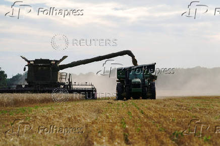 FILE PHOTO: Farmer harvests winter wheat crop in Oklahoma