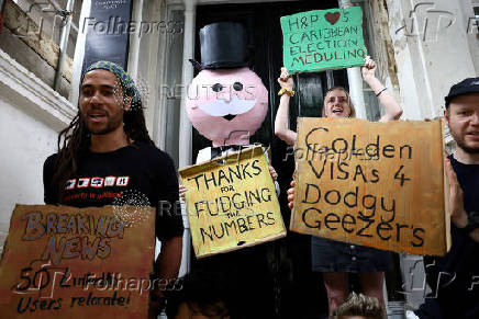 Green New Deal Rising protest outside Henley & Partners in London