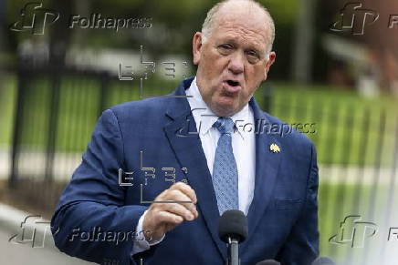 White House border czar Tom Homan talks with news media outside the White House