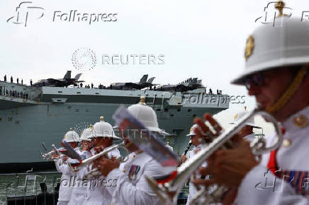 Britain's HMS Prince of Wales aircraft carrier arrives at Marina Bay Cruise Centre in Singapore