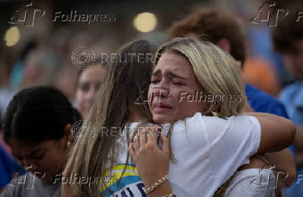 People attend a prayer service for flood victims in Kerrville