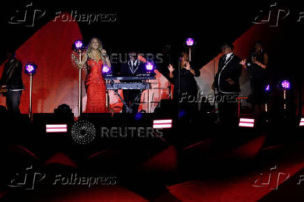 Mariah Carey performs on a floating stage shaped like a giant Victoria amazonica water lily at the Guama River in Belem