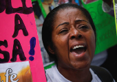 Family members of migrants imprisoned in El Salvador protest outside the United Nations building, in Caracas