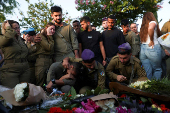 People mourn Israeli soldier Staff Sergeant Lior Steinberg, in Petah Tikva