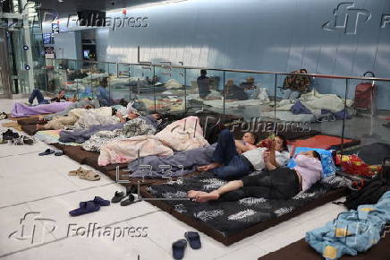 People shelter at Tel Aviv Light Rail Station amid ongoing Iranian ballistic missile threat