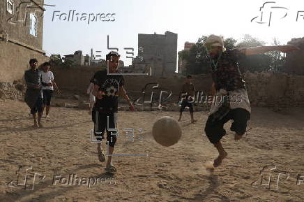 Yemeni youths play soccer in Sana'a