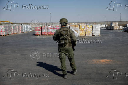 Humanitarian aid is waited to be transferred into Gaza from Israel, at the Gaza part of the Kerem Shalom crossing in the Gaza Strip