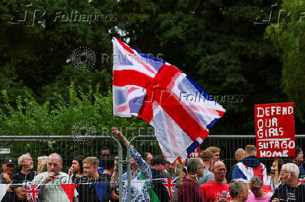Protests outside a hotel used for housing asylum seekers, in Epping