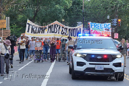 People protest after U.S. President Trump announced he would deploy the National Guard to the nation's capital and place D.C.'s Metropolitan Police Department under federal control, in Washington