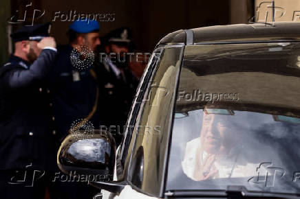 Pope Francis looks on as he leaves Regina Coeli prison after a visit, in Rome