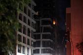 Fire seen in a building at an impact site following a missile attack from Iran on Israel, at Tel Aviv