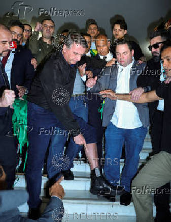 FILE PHOTO: Former Brazilian President Bolsonaro speaks to the media at the National Congress in Brasilia