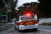 A police officer stands guard outside Stanley Prison during the release of former lawmakers Kwok Ka-ki and Jeremy Tam, convicted in a landmark national security case, in Hong Kong