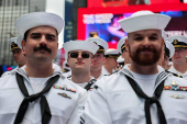 U.S. Navy sailors line up for a group portrait in Times Square during Fleet Week 2025